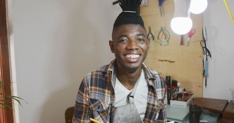 Happy African American Craftsman in Workshop, Smiling and Productive