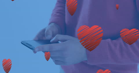 Hands Engaging with Smartphone Featuring Heart Icons Overlay
