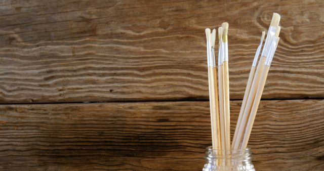 Jar of Artist Paintbrushes Against Rustic Wood Background - Download Free Stock Images Pikwizard.com