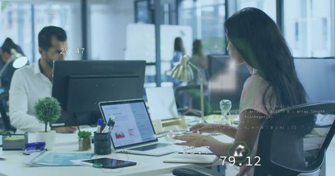 Busy Workspace With Focused Business Professionals Using Technology