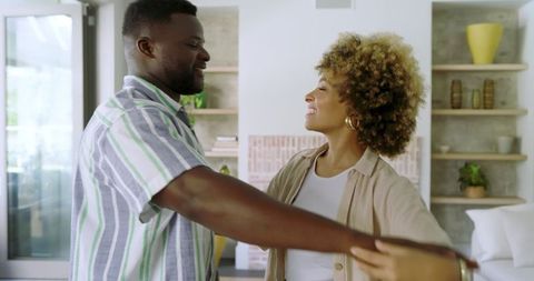 Romantic Couple Embracing in Modern Stylish Living Room