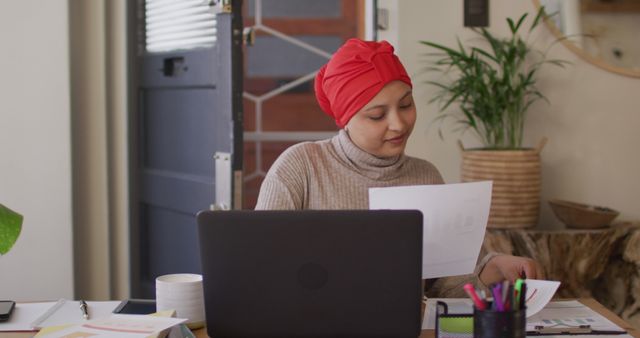 Young Woman in Red Hijab Working at Home Office - Download Free Stock Images Pikwizard.com