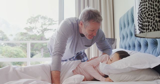 Father Waking Daughter with Smile in Modern Bedroom - Download Free Stock Images Pikwizard.com