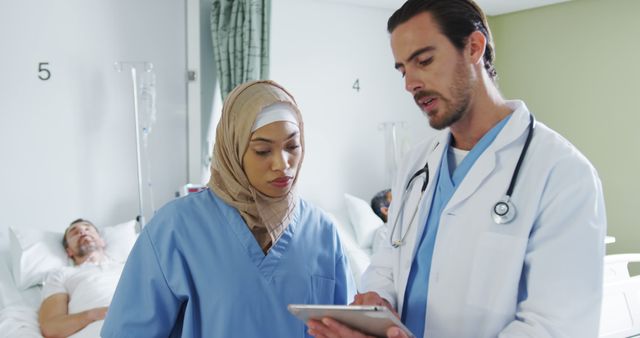 Diverse Medical Team Discussing Patient's Chart in Hospital Ward - Download Free Stock Images Pikwizard.com