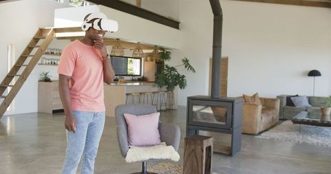 Man Immersed in Virtual Reality in Modern Living Room Setting