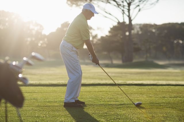 Mature Man Playing Golf on Sunny Day - Download Free Stock Photos Pikwizard.com