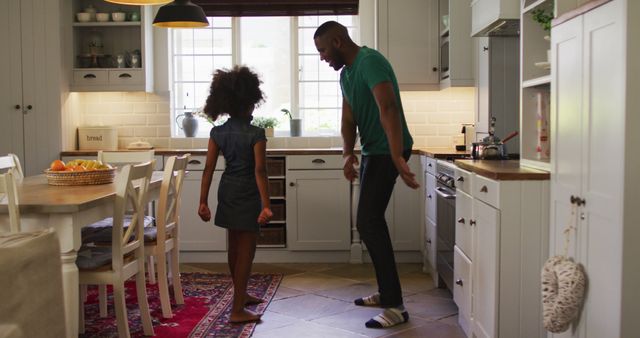 Father and Daughter Dancing in Kitchen Together - Download Free Stock Images Pikwizard.com