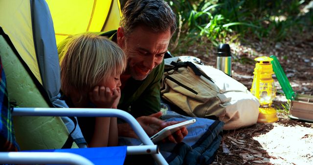 Father and Son Relaxing at Campsite Tent Outdoor Adventure - Download Free Stock Images Pikwizard.com