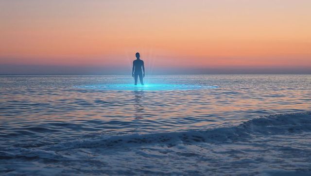 Standing silhouette watching cyan halo rising from ocean while pastel sunset glowing