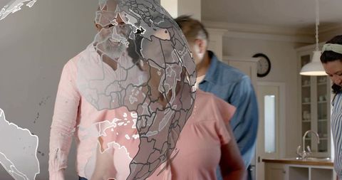 Multigenerational family in modern kitchen with globe overlay suggesting global ties