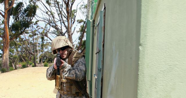 Soldier in combat gear holding rifle on high alert - Download Free Stock Images Pikwizard.com