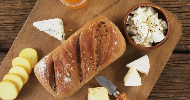 Rustic Bread with Assorted Cheeses on Wooden Board - Download Free Stock Images Pikwizard.com