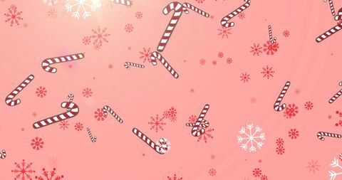 Festive candy canes and snowflakes on pink background