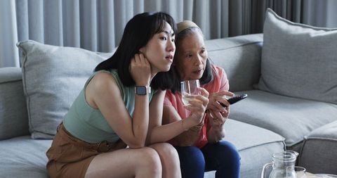 Intergenerational Bonding at Home: Grandmother and Granddaughter Relaxing