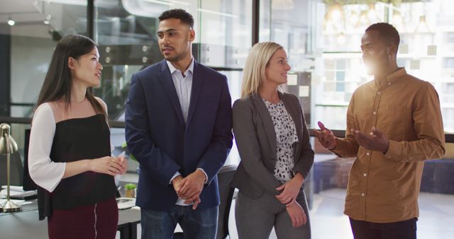 Multiracial Team Engaging in Office Discussion at Workplace - Download Free Stock Images Pikwizard.com