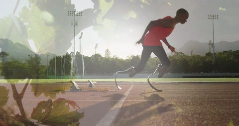 Paralympic athlete sprinting on track with blade prosthetics