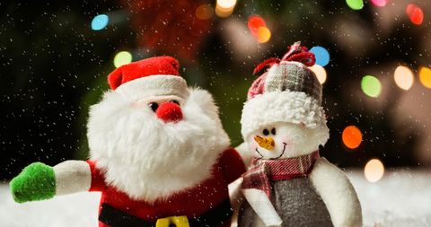 Festive Santa Claus and Snowman Surrounded by Falling Snow - Download Free Stock Images Pikwizard.com