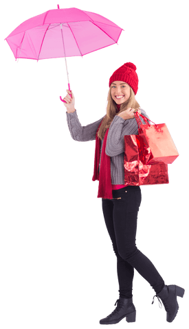 Smiling woman with pink umbrella holding shopping bags