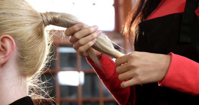 Hairdresser Styling Blonde Ponytail in Salon - Download Free Stock Images Pikwizard.com