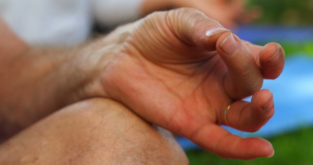 Close-Up of Hand in Meditation Pose Outdoors - Download Free Stock Images Pikwizard.com