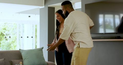 Couple embracing sincere joy upon heartwarming anniversary surprise