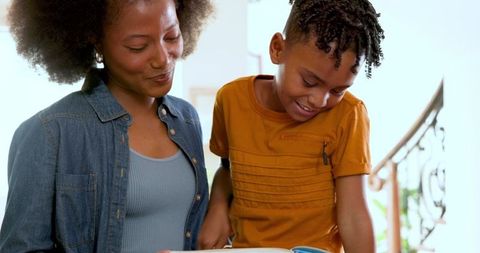 Mother and Son Reading Together at Home