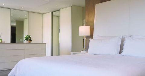 Modern Bedroom with White Linens and Elegant Decor