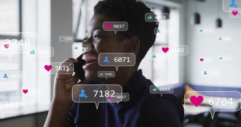 Smiling professional holding phone in bright office with social media engagement alerts