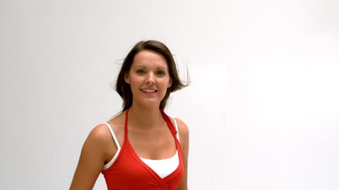 Cheerful Woman Turns in Red Top Slow Motion