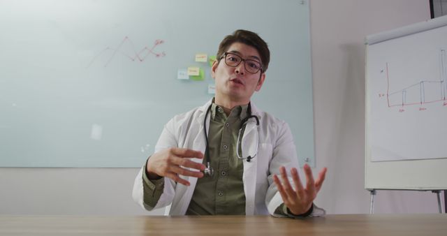 Confident Male Doctor Explaining Medical Concepts in Modern Office - Download Free Stock Images Pikwizard.com