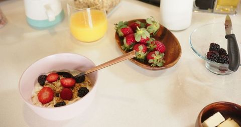 Healthy breakfast bowl of yogurt, granola, and fresh berries