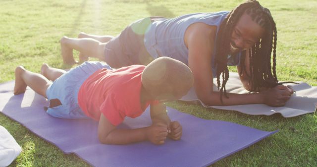 African American Mother and Son Planking Together Outdoors - Download Free Stock Images Pikwizard.com