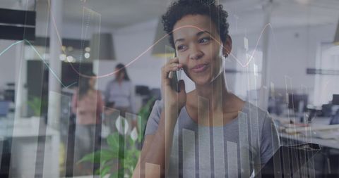 Smiling Businesswoman on Smartphone with Financial Graphics