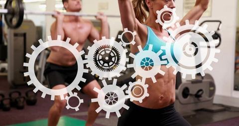 Female athlete pressing barbell overhead with gears overlay in gym for strength training