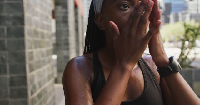 Sweaty woman cooling down after an intense workout in urban setting - Download Free Stock Images Pikwizard.com