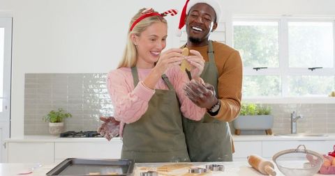 Diverse Couple Making Holiday Cookies in Home Kitchen