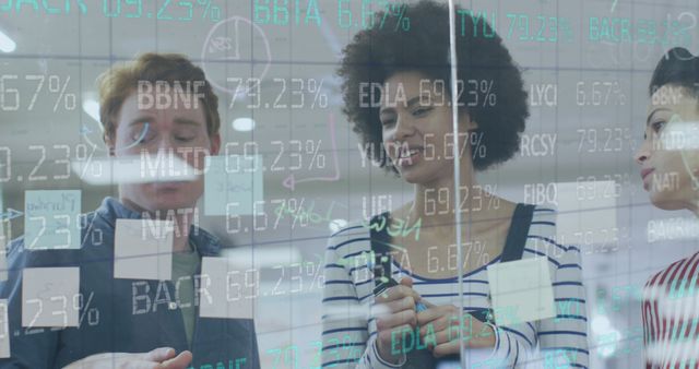 Diverse Team Analyzing Financial Data on Digital Screen - Download Free Stock Images Pikwizard.com