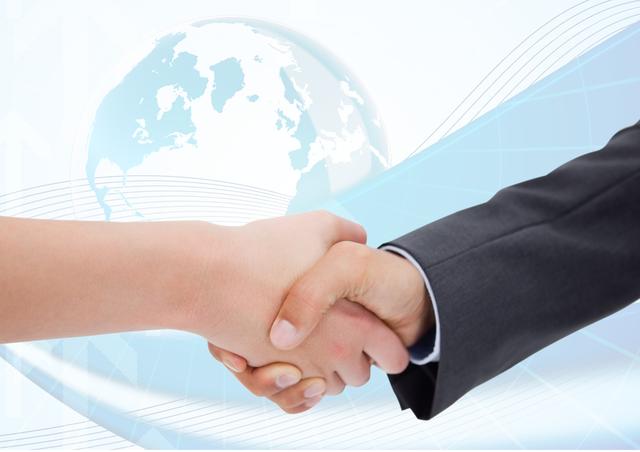 Digital composition of businesspeople shaking hands with each other against globe in the background