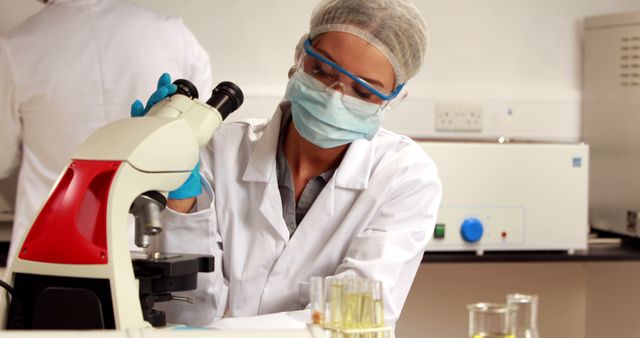 Scientist Conducting Microscope Analysis in Laboratory - Download Free Stock Images Pikwizard.com