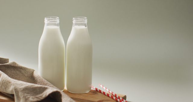 Image of glass bottles of milk on white background. dairy products and healthy organic nutrition.