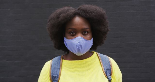 Confident Woman Wearing Face Mask Against Black Background - Download Free Stock Images Pikwizard.com