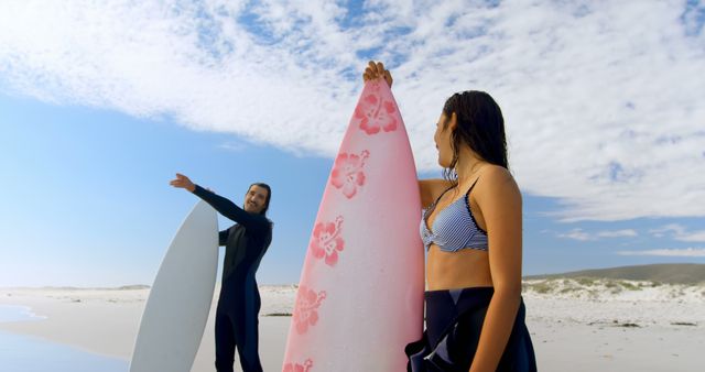 Surfers Handing Surfboards Each Other Sunny Beach - Download Free Stock Images Pikwizard.com