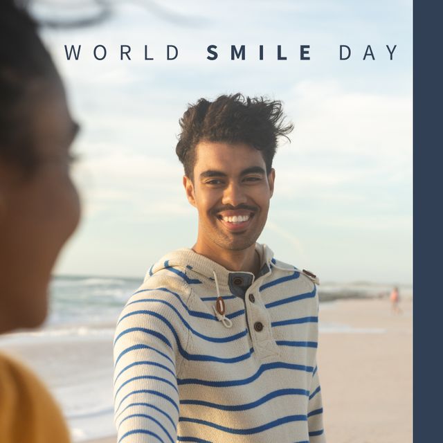 Composition of world smile day text over biracial man smiling on blue background. World smile day and celebration concept digitally generated image.