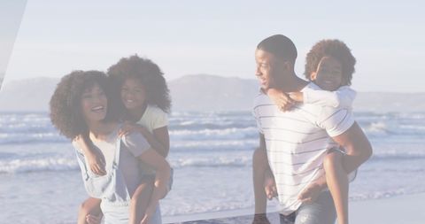Joyful Family Spending Fun Time on Sunny Beach