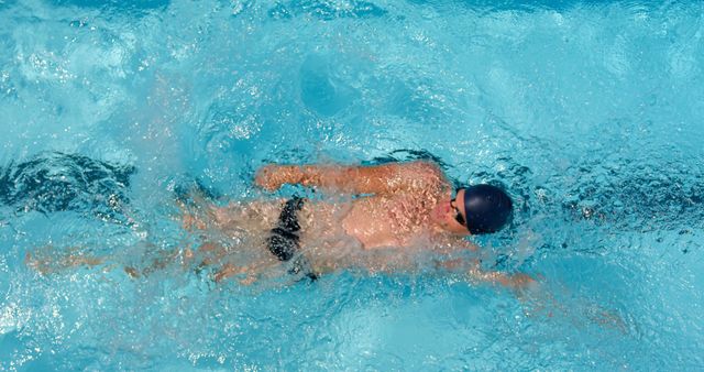 Competitive Swimmer Performing Backstroke in Pool - Download Free Stock Photos Pikwizard.com