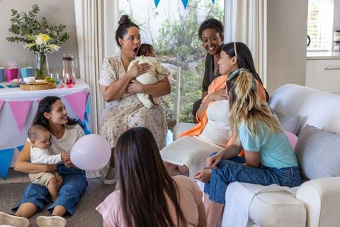 Joyful women's gathering celebrating baby shower