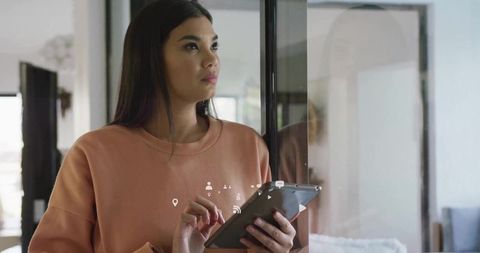 Modern Woman Using Tablet in Bright Minimalist Space