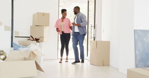Couple joyfully moving into new home embracing new beginnings