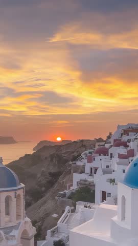 Sunrise bathing Santorini clifftop villages and blue-domed chapels, pastel Aegean sky