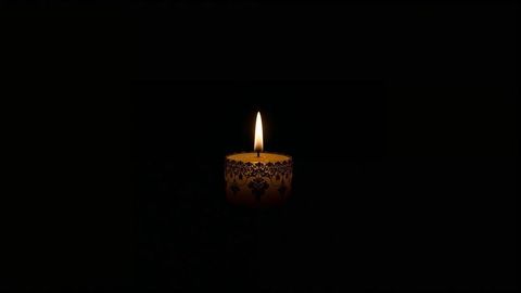 Decorative wax candle illuminating darkness in calming silence